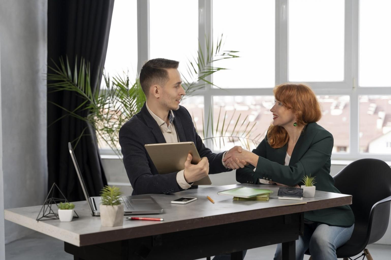 Business owner analyzing efficiency metrics on laptop